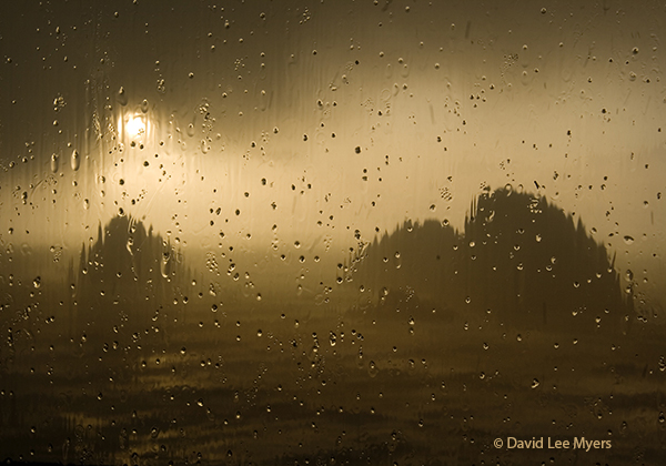 Three Arch Rocks seen through rain drops on window, Oceanside, Oregon.